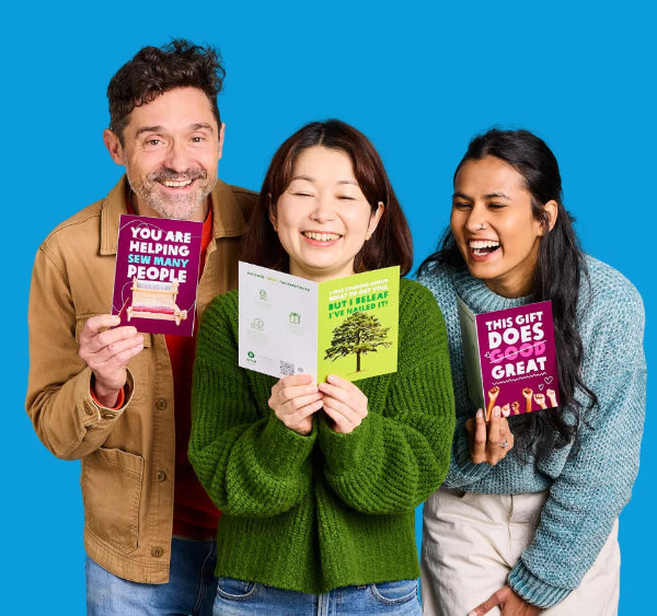 Australia: Oxfam staff members hold up Oxfam Unwrapped cards. Photo: Michelle Jarni Australia: Oxfam staff members hold up Oxfam Unwrapped cards. Photo: Michelle Jarni