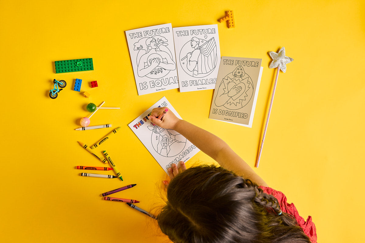 Australia: A child colours in the Oxfam Unwrapped card ‘The future is courageous’. Photo: Michelle Jarni