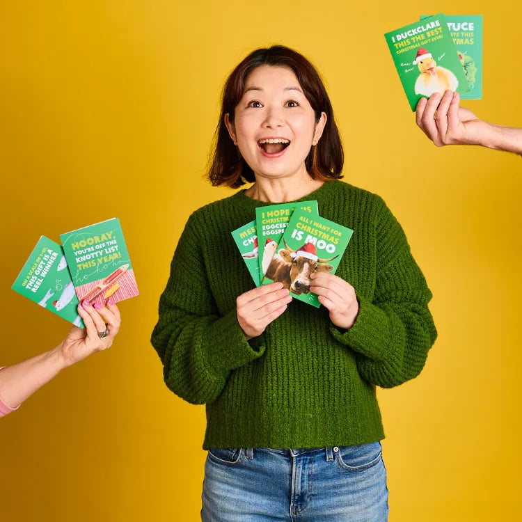 Australia: Mariko holds up an Oxfam Unwrapped card. Photo: Michelle Jarni