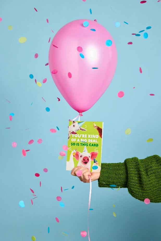 20th Anniversary Collector's Card with a balloon and confetti. Photo: Michelle Jarni