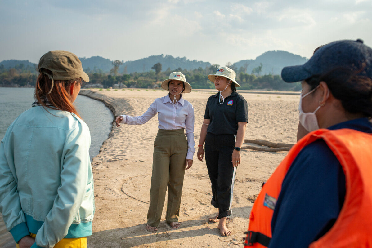 Koh Han, Stung Treng, Cambodia: Chantha guides MVi staff and production crews during a tour along the Mekong with Sai campaign. Photo: Bandiddh Prum/Oxfam