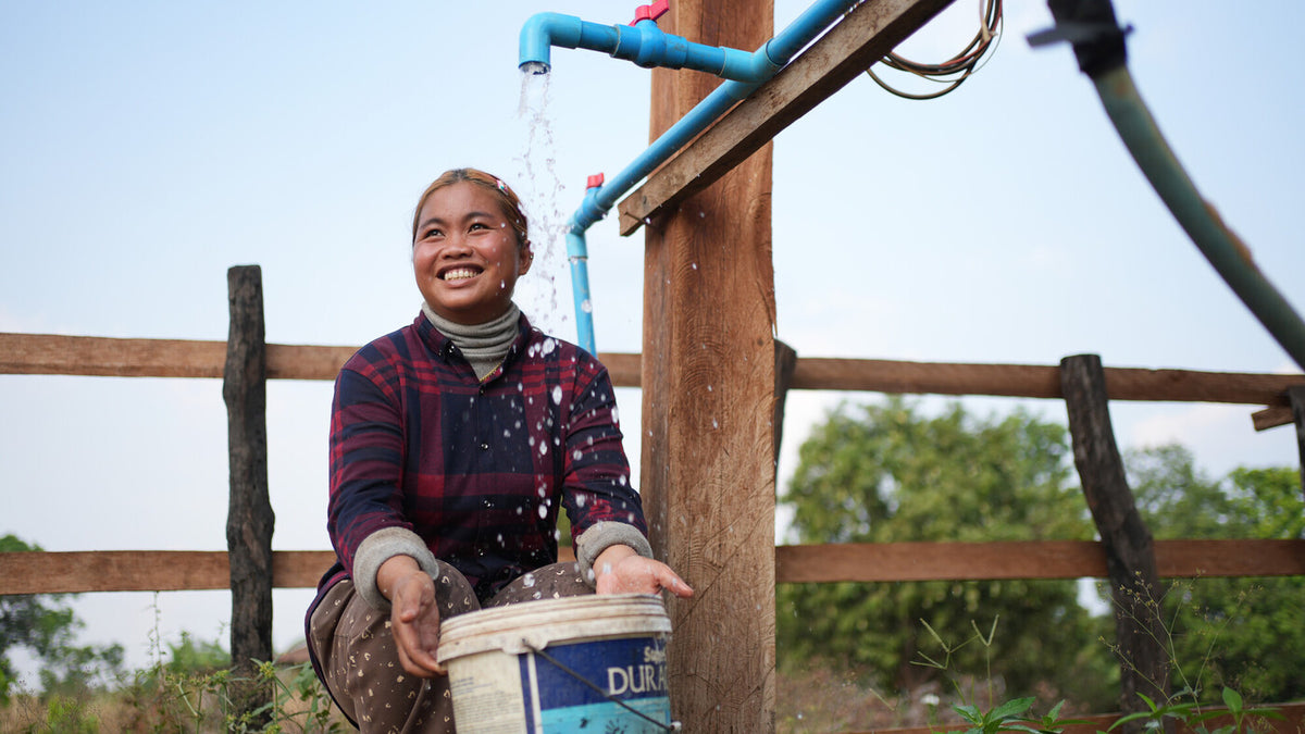 Cambodia: Srey Ngor is a farmer, day labourer, and the Clean Water Station Group treasurer. She helps to maintain the solar-powered water system for 30 families in the village. Photo: Aimee Han/Oxfam